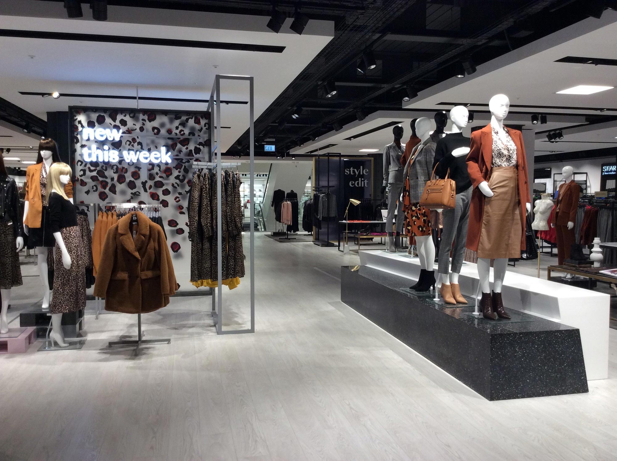 An image of suspended ceilings inside in Debenhams department store in Watford, installed by Construction Interior Design.