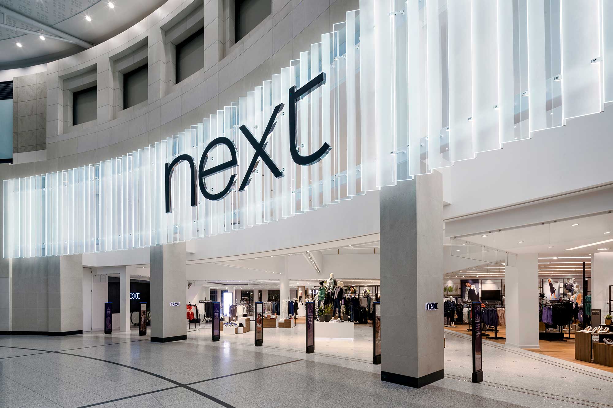 An image of the outside of Next in the Arndale Centre in Manchester, following on from refurbishment by Construction Interior Design.
